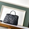 Gucci Marmont Small Top Handle Bag Black sử dụng chất liệu da bê nguyên bản, chuẩn 99% cam kết chất lượng chuẩn nhất