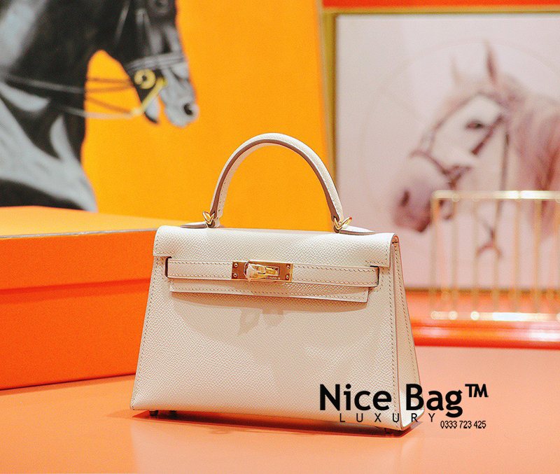 Hermes Kelly Bag Mini White like authentic sử dụng chất liệu chính hãng, sản xuất hoàn toàn bằng thủ công, cam kết chất lượng tốt nhất, chuẩn 99% so với chính hãng, full box và phụ kiện