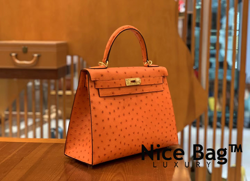 Hermes Kelly 28 Ostrich Orange like authentic cam kết chất lượng tốt nhất dùng không ai biết sử dụng chất liệu da đà điểu nam phi, may hoàn toàn bằng thủ công, full box và phụ kiện