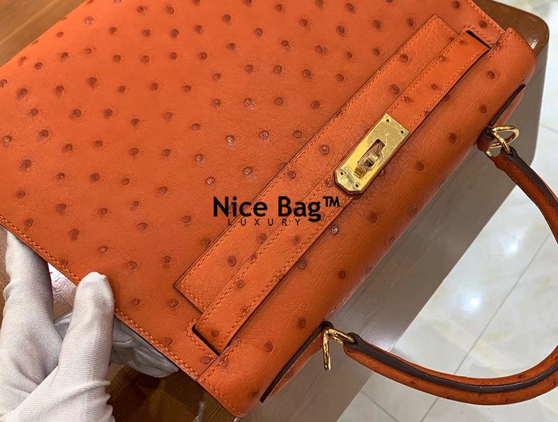 Hermes Kelly 28 Ostrich Orange like authentic cam kết chất lượng tốt nhất dùng không ai biết sử dụng chất liệu da đà điểu nam phi, may hoàn toàn bằng thủ công, full box và phụ kiện