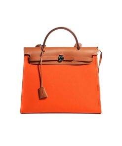 Hermes Herbag Zip Bag Orange Brown like authentic sử dụng chất liệu vải cavan và da bò nhập ý nguyên bản so với chính hãng, sản xuất hoàn toàn bằng thủ công, cam kết chất lượng tốt nhất